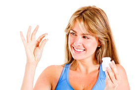 Woman Taking Tablet